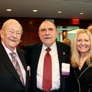 Three people grouped together smiling at camera. Read about Gifts by Estate Note