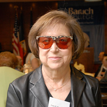 Lady in cool sunglasses smiling. Read about Gifts of Cash, Checks, and Credit Cards 